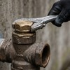 Technician inspecting dry riser inlet assembly